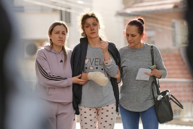 <p>A victim of the Pulse Club fire is accompanied at Stip General Hospital on 16 March 2025 in Stip, North Macedonia</p>