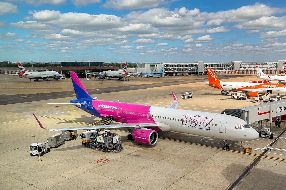 Wizz Air baggage handler caught on camera hurling luggage off plane