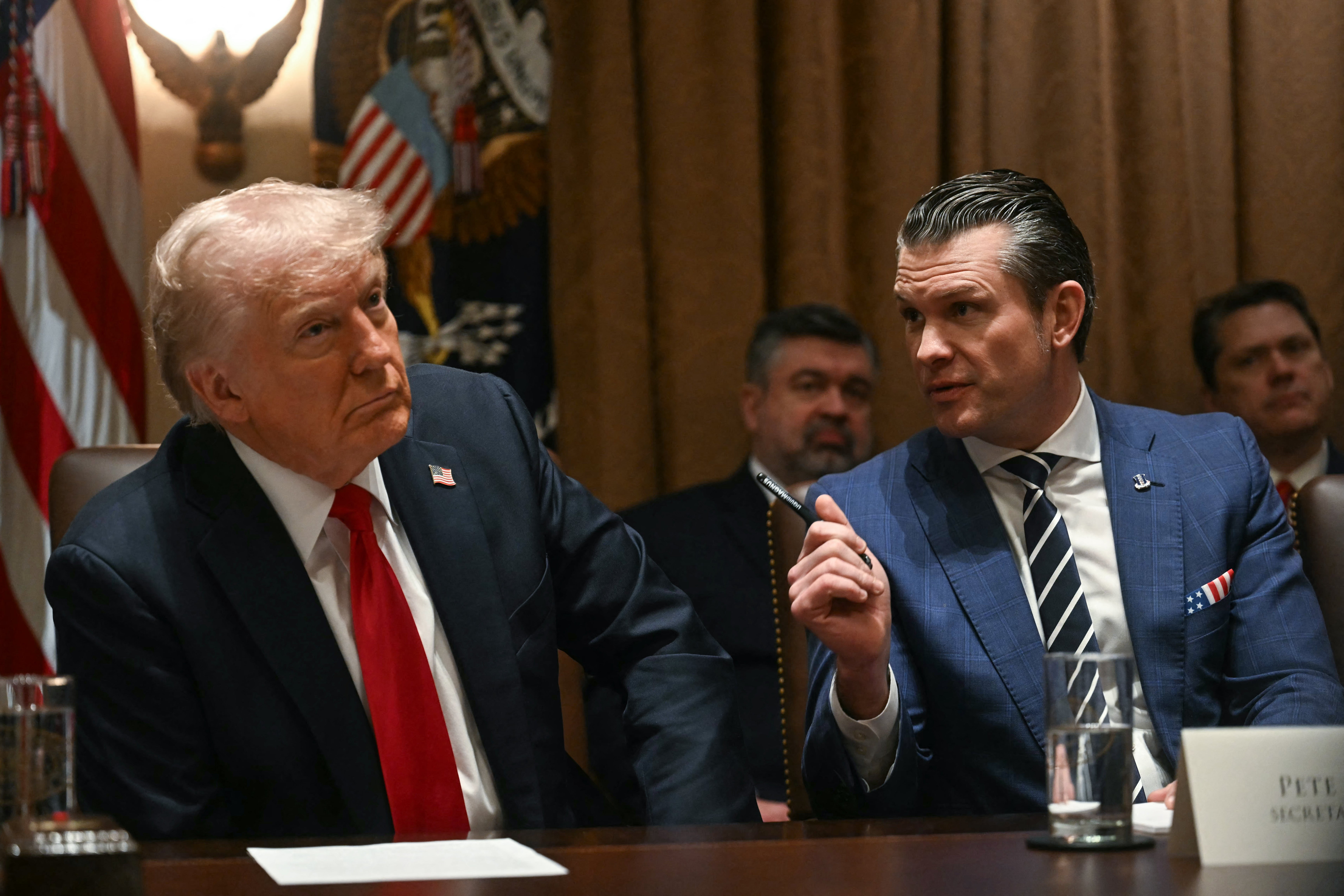 Both Donald Trump (L) and Pete Hegseth denied claims that Musk would be briefed on the U.S. war plans for China