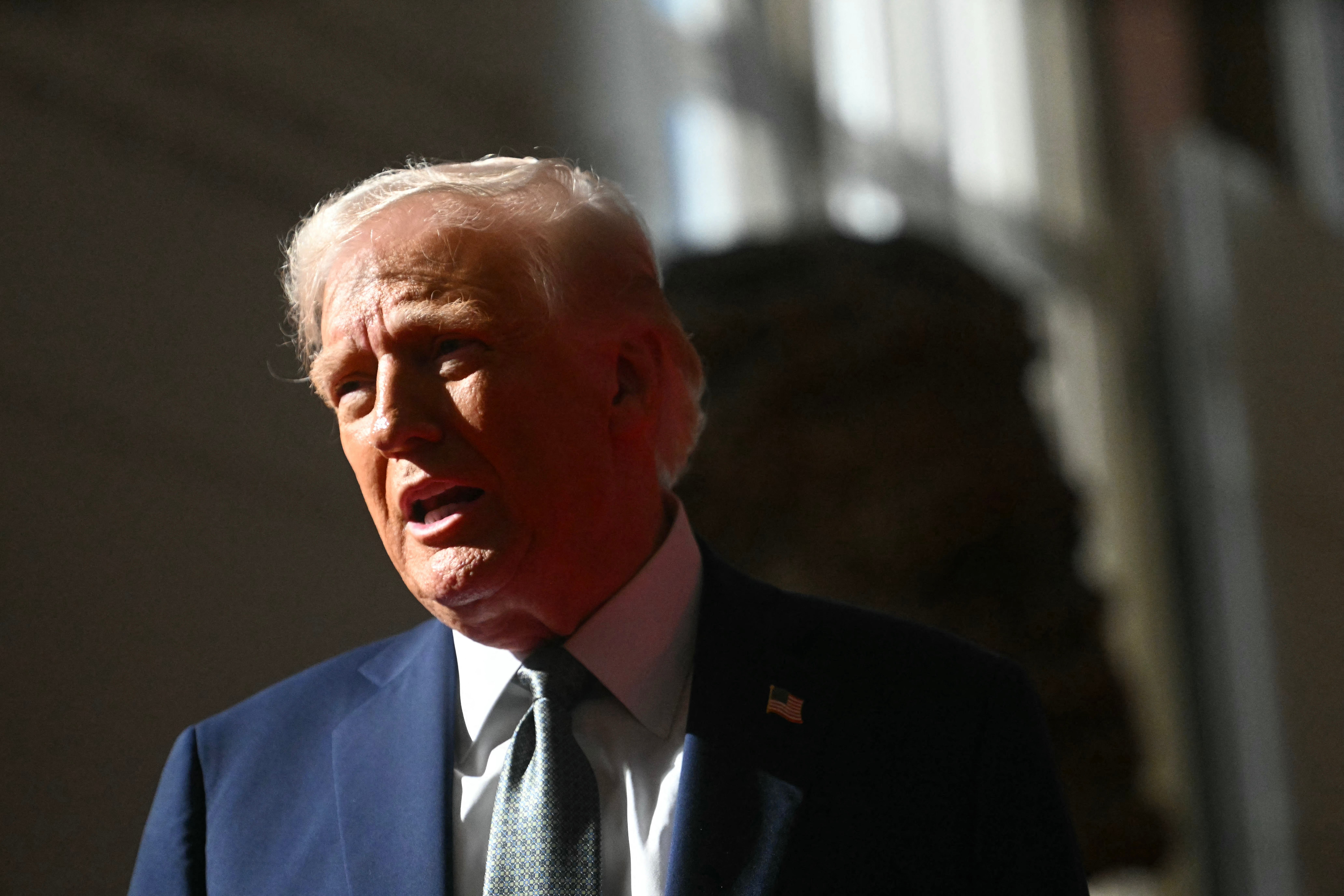 Donald Trump talks to members of the media as he visits the John F Kennedy Center for the Performing Arts in Washington