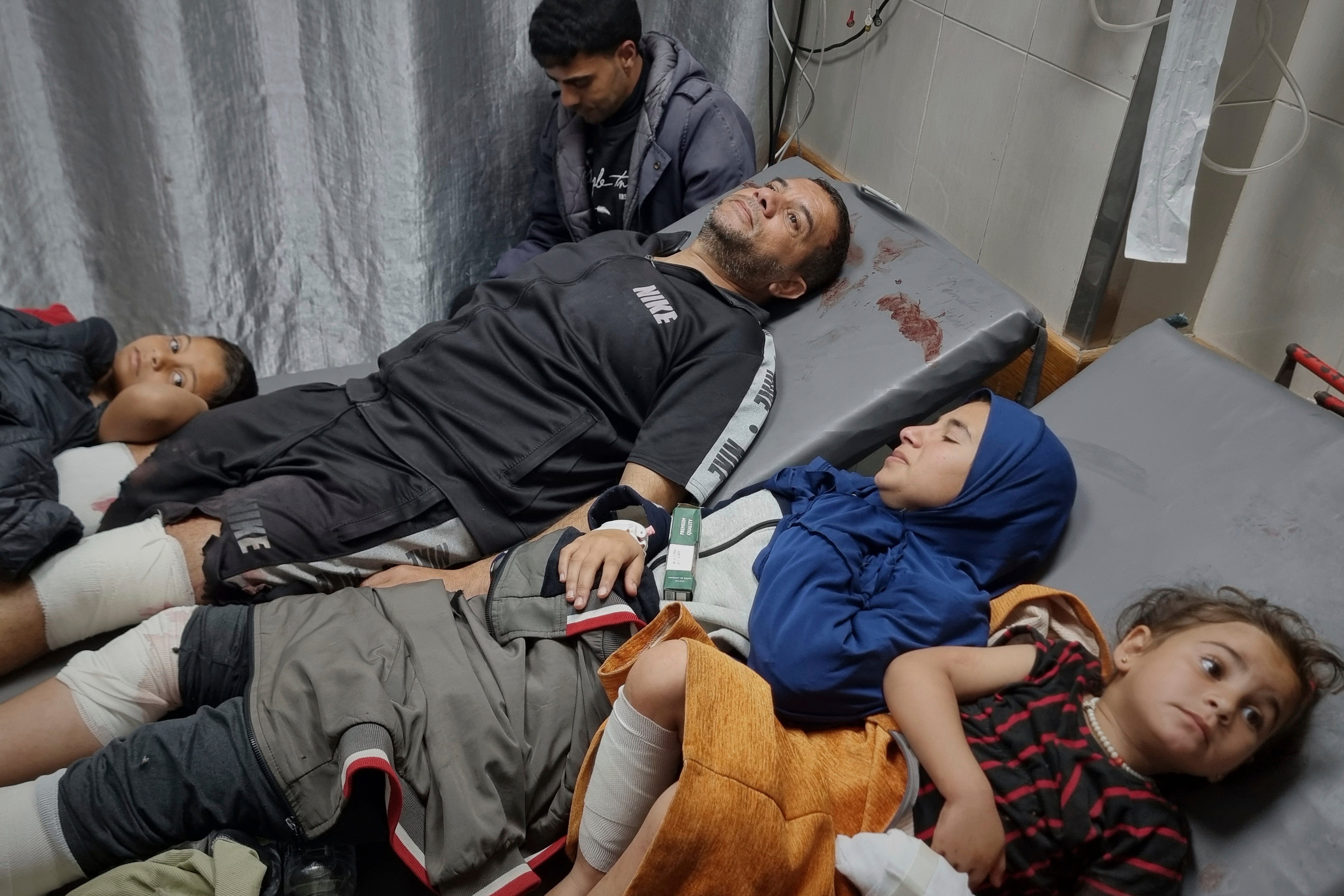 Injured Palestinians wait for treatment at the hospital following Israeli army airstrikes in Khan Younis, southern Gaza Strip, Tuesday, 18 March 2025