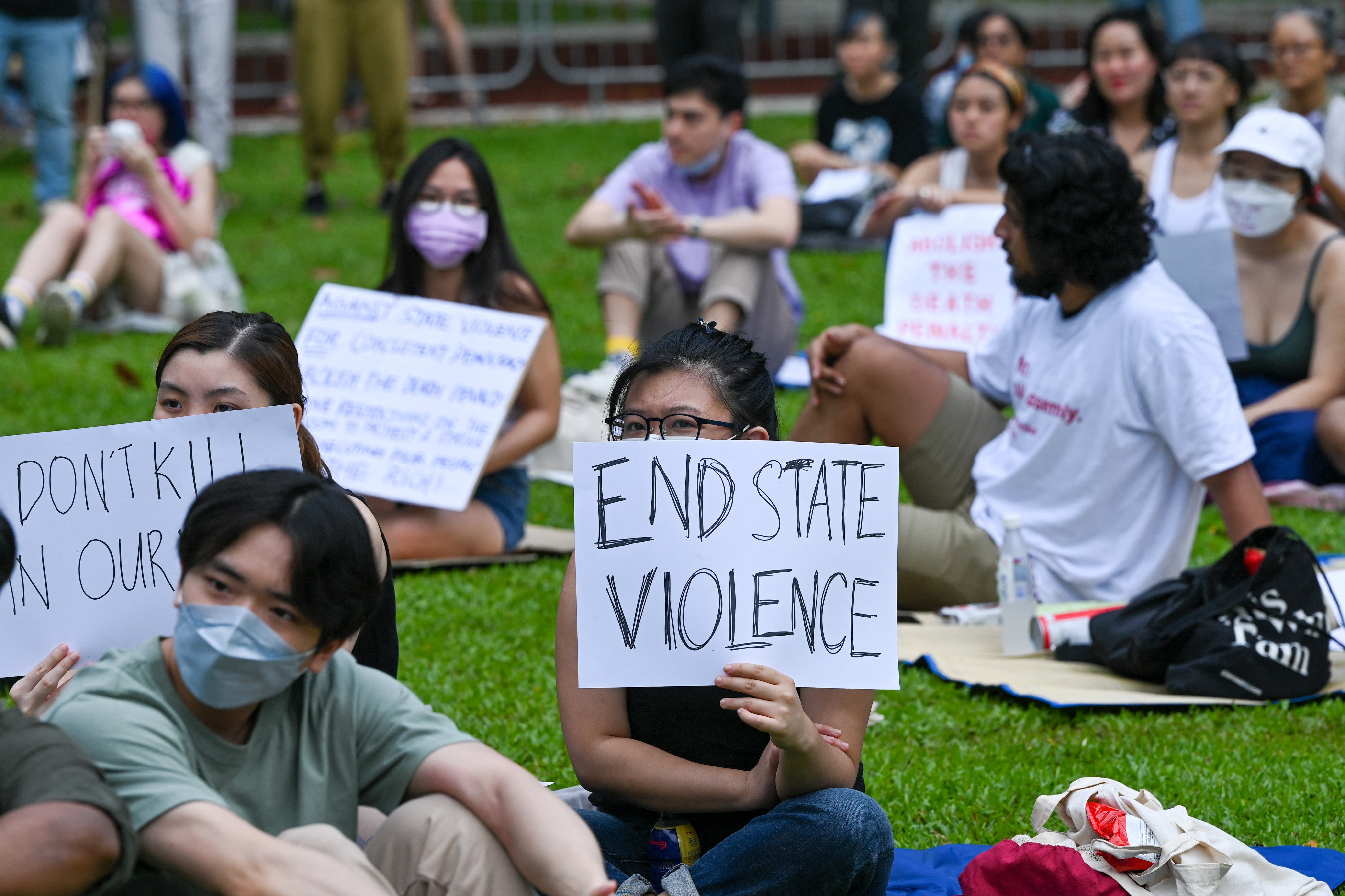 <p>Representative. Protesters holding signs demanding abolition of the death penalty</p>
