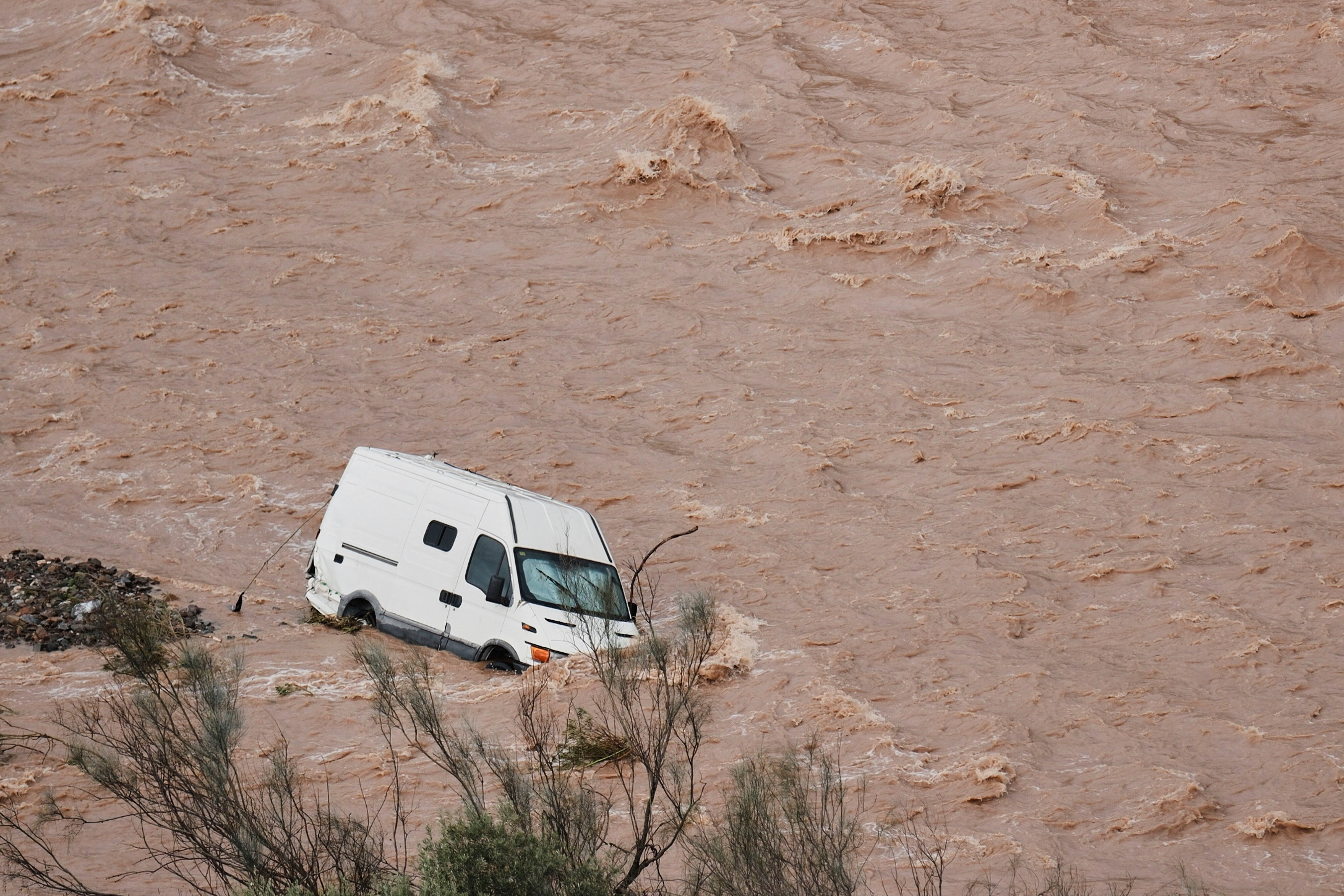 A van swept away by the flooding in Casasola, Malaga, on Tuesday