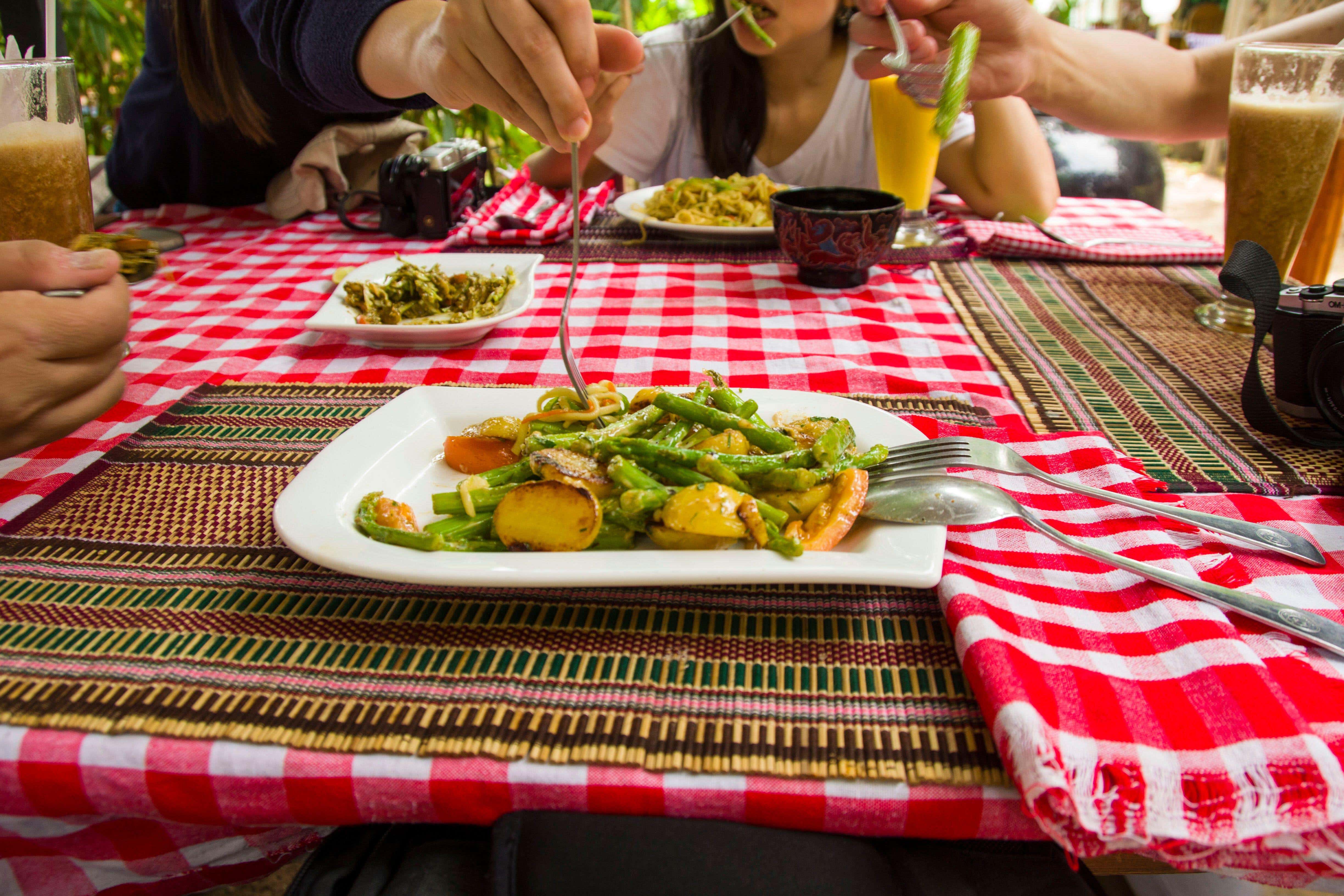 Research has indicated that sharing mealtimes with others is linked to better wellbeing (Alamy/PA)