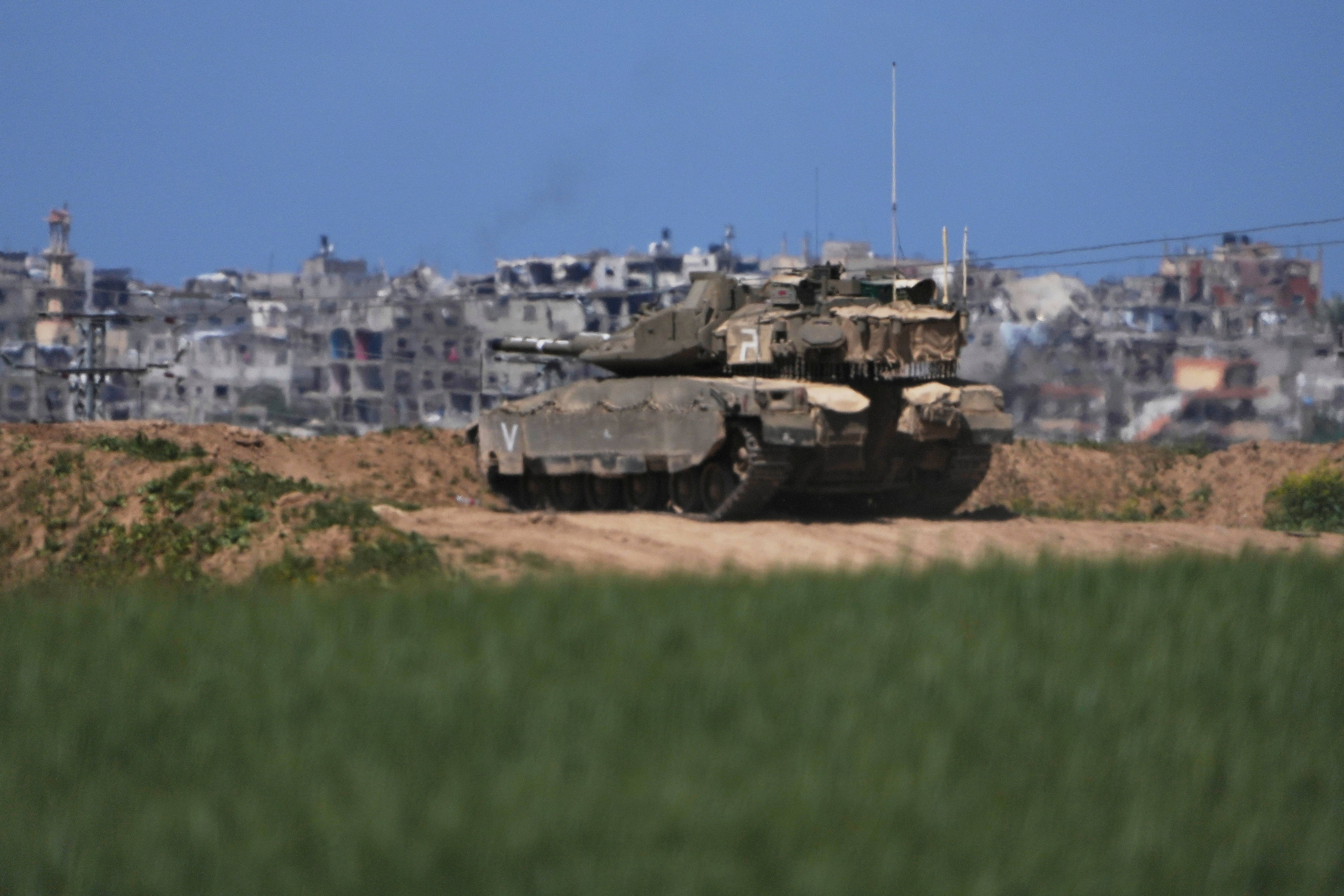 An Israeli tank takes position on the Gaza Strip border in southern Israel, Wednesday, 19 March 2025