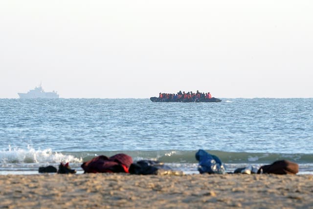 <p>A boat of around 40 people picked up more migrants on the coast of Gravelines (Gareth Fuller/PA)</p>