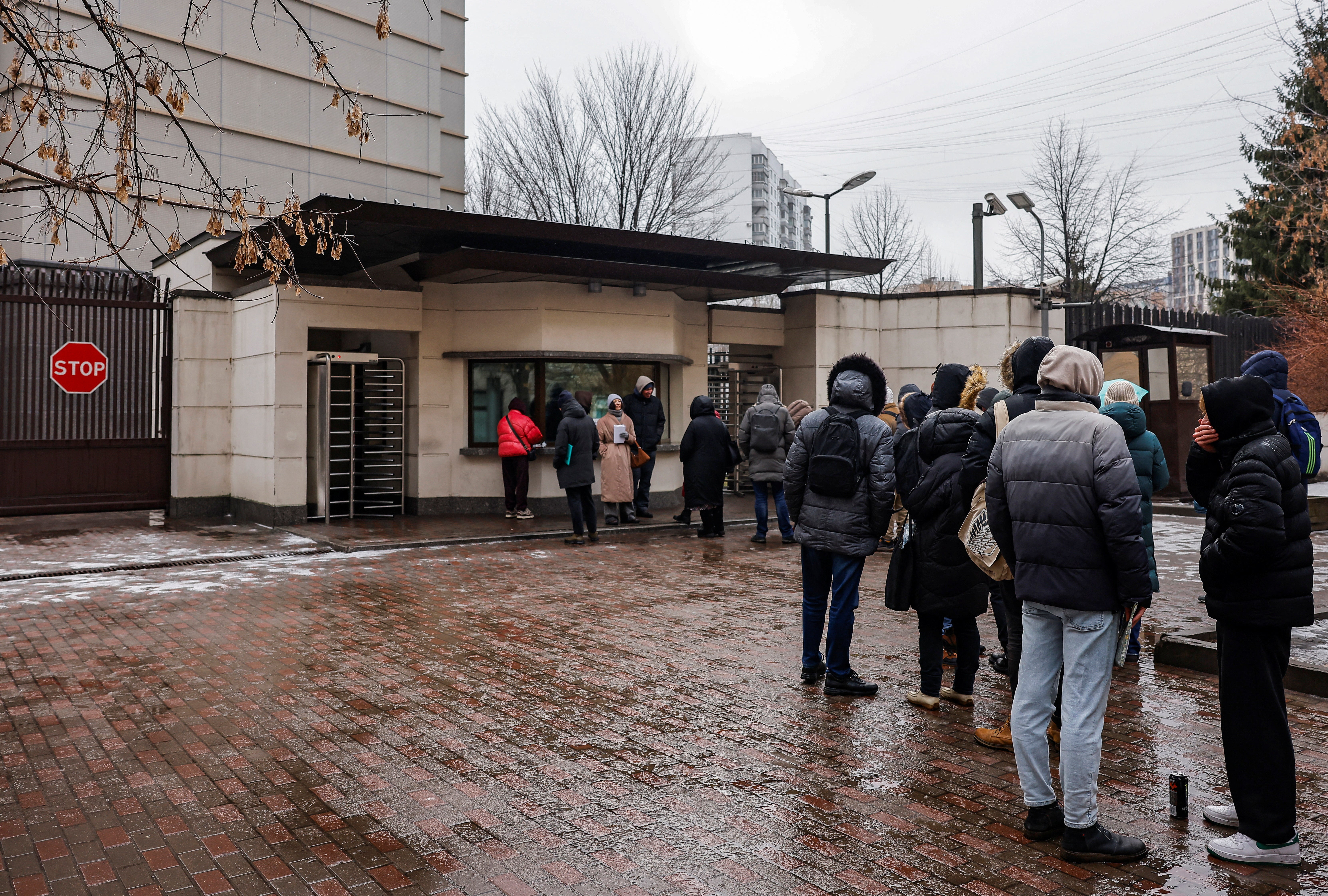 People queue to apply for visas at the Japanese embassy in Moscow