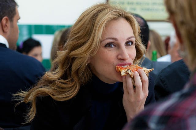 <p>Pizza the action: Julia Roberts slices it up in 'Eat Pray Love'</p>