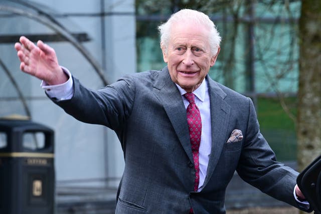 King Charles waves goodbye to well-wishers following a visit to the Cancer Research Centre at Ulster University, on day two of the royal visit to Northern Ireland (Anthony Harvey/PA)