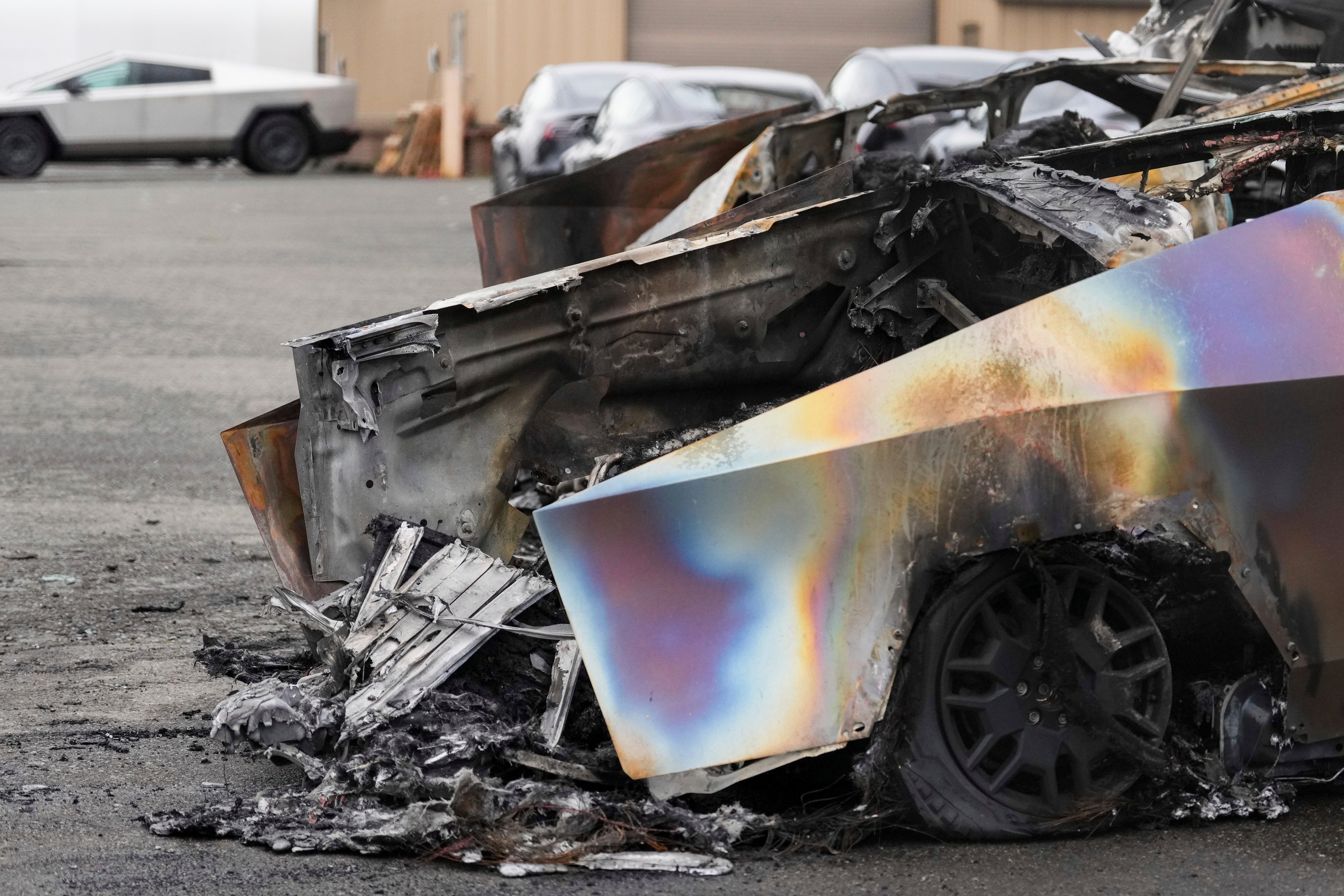 A burned Tesla Cybertruck is parked at a Tesla lot in Seattle, Monday, March 10, 2025