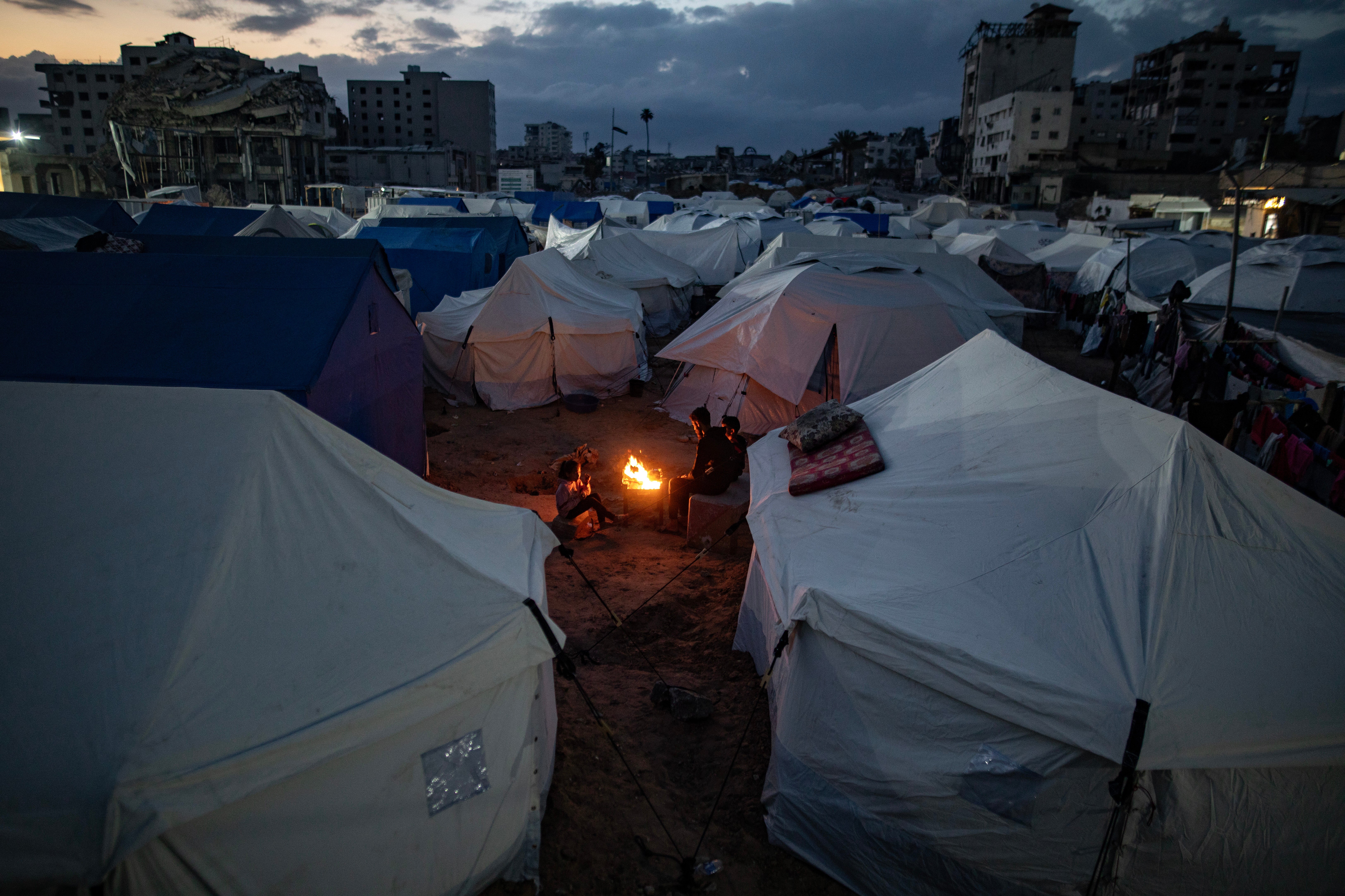 Displaced Palestinians from northern Gaza City set up their tents in the city center after evacuation orders were issued by the Israeli occupation army for the northern areas of the city, in Gaza City