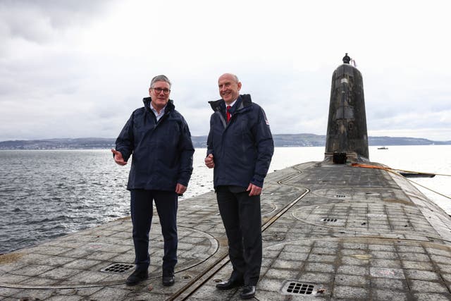 <p>Keir Starmer and John Healey visit a Vanguard class submarine off the coast of Scotland earlier this year</p>