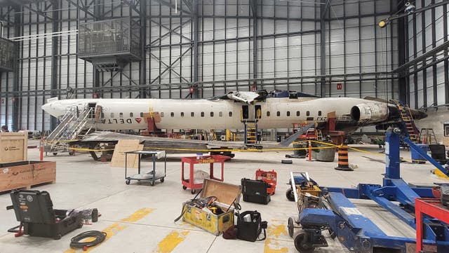 <p>The CRJ-900 aircraft resting at the GTAA hangar after the accident at Toronto Pearson Airport, Ontario</p>