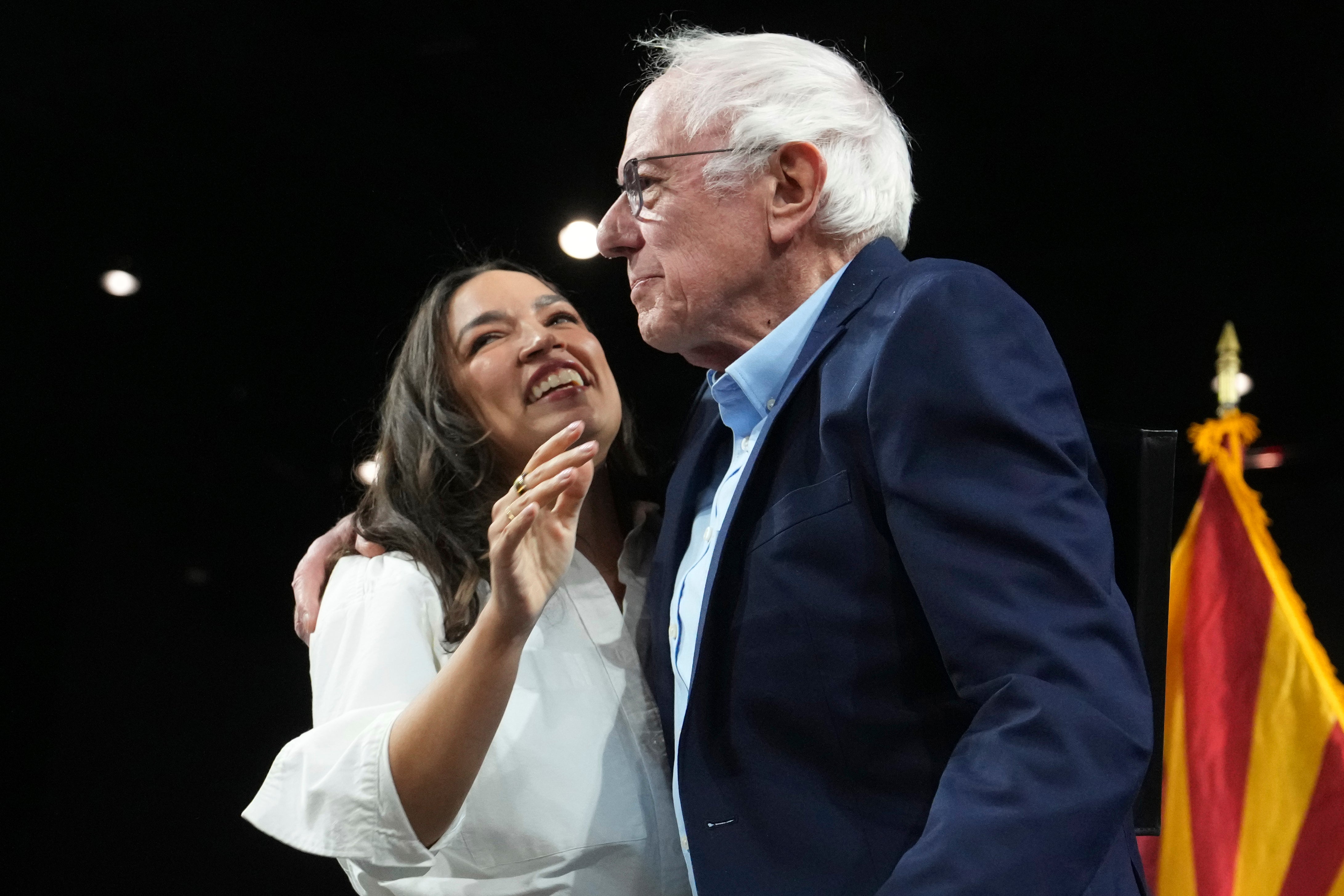 New York Rep. Alexandria Ocasio-Cortez, D-N.Y. greets Vermont Senator Bernie Sanders, as he arrives to speak during a ‘Fighting Oligarchy’ tour event at Arizona State University in Tempe on Thursday