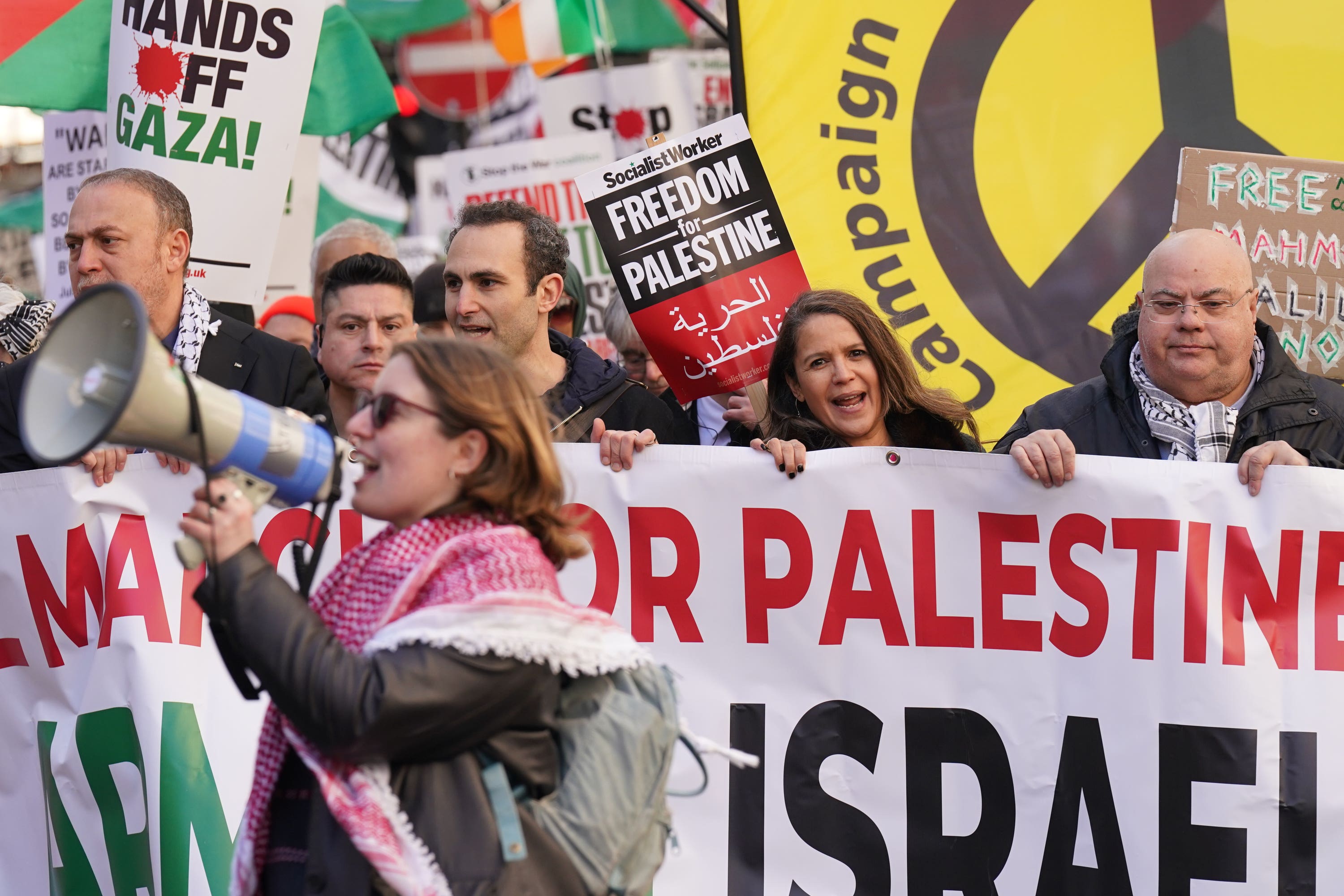 People take part in a pro-Palestine march in central London, organised by a number of groups under the Palestine Coalition banner (PA)