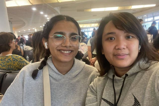 Farah Rafeeq (left) and Niken Wulan were frustrated to miss part of their close friend’s wedding after a fire which closed Heathrow airport’s transport hub on Friday (Farah Rafeeq/PA)