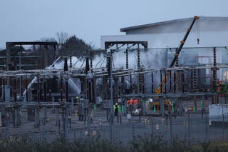 People work at an electrical substation, after a fire there wiped out the power at Heathrow International Airport, in Hayes, London, Britain, 21 March 2025