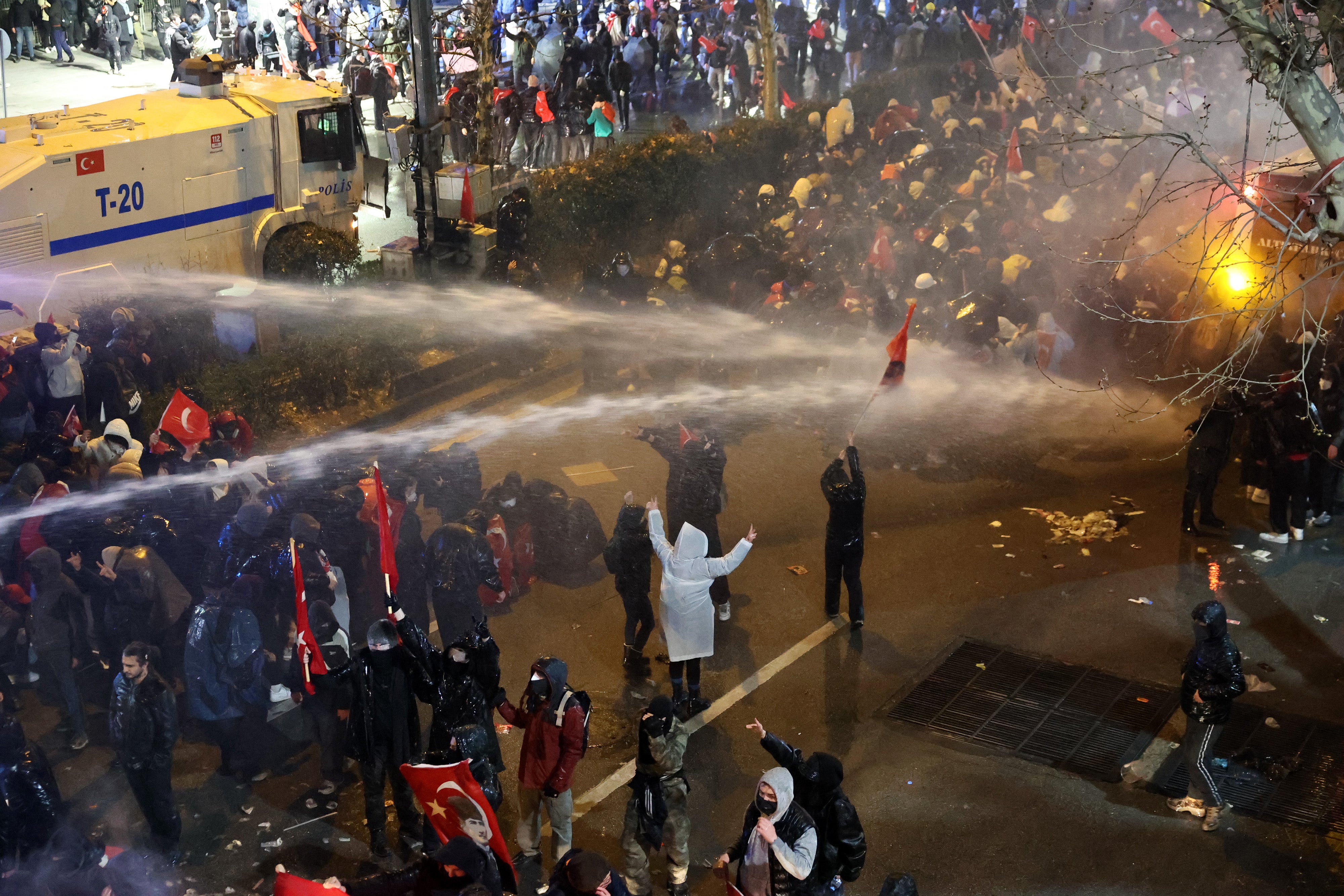 Protesters clash with Turkish anti-riot police as they use teargas and water cannon during a demonstration in Ankara