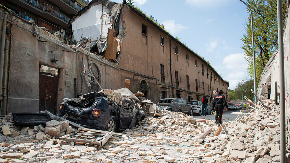 <p>Emergency services at the scene after an explosion at a building thought to be a gas leak in Rome </p>