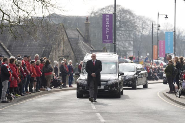 A hearse carrying the coffin of 10-year-old Poppy Atkinson makes its way to Kendal Parish Church ahead of her funeral service (Danny Lawson/PA)