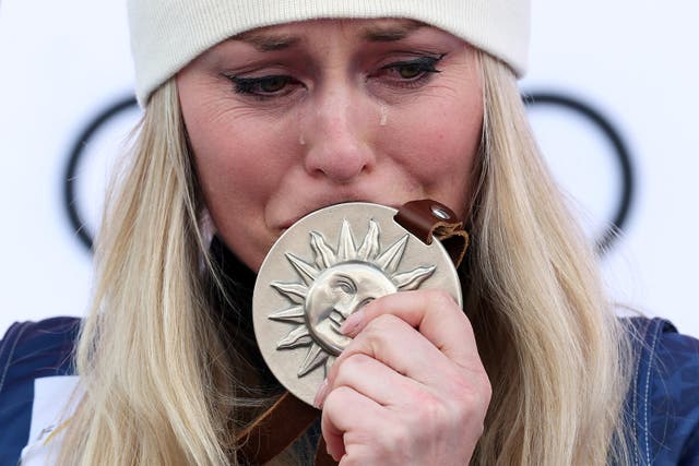 <p>An emotional Lindsey Vonn on the podium after her second-place finish at the 2025 World Cup</p>