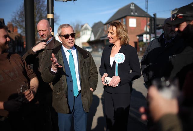 <p>Nigel Farage and Reform’s candidate for the Runcon and Helsby by-election, Sarah Pochin, campaigning in Frodsham</p>