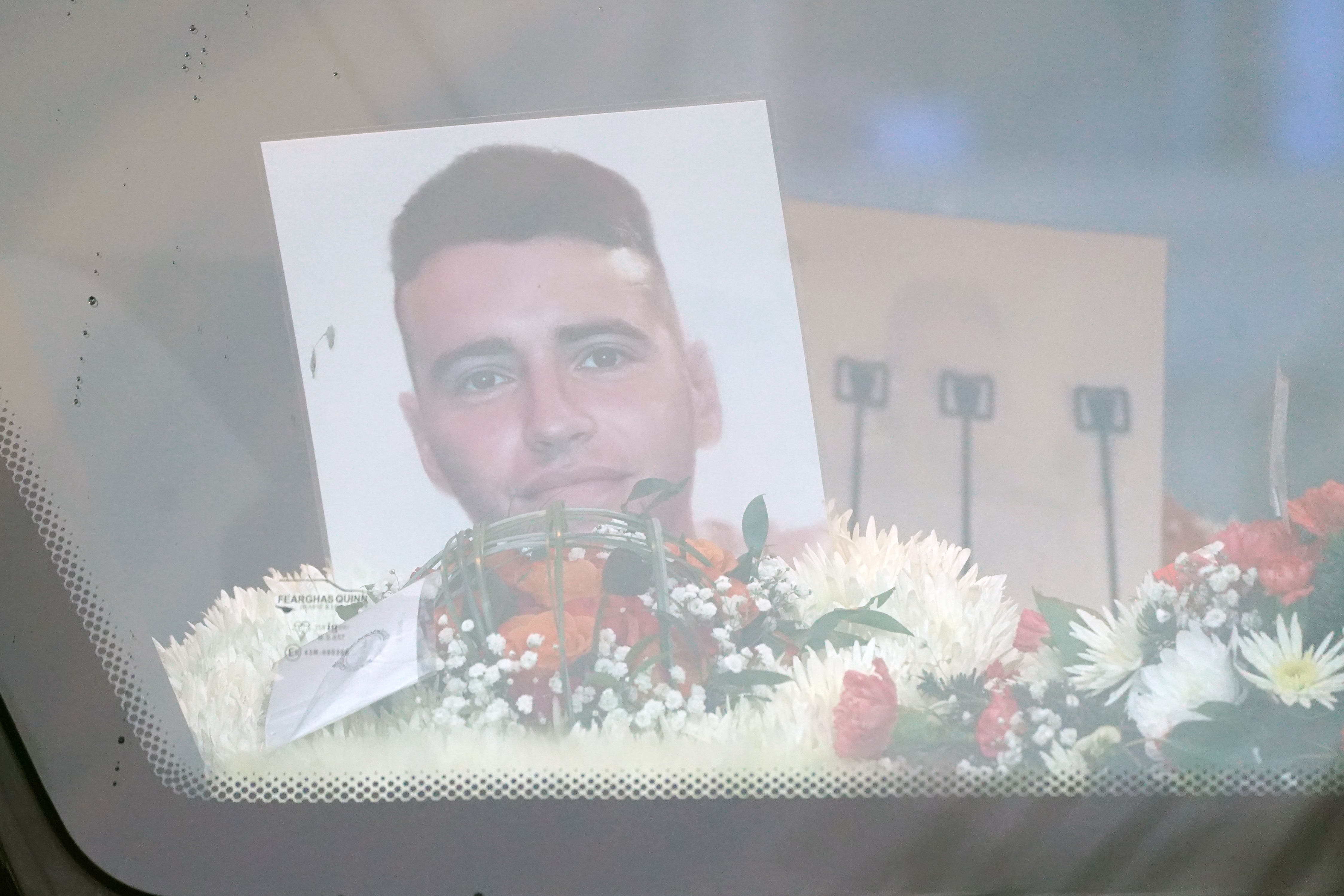A photograph of Private Sean Rooney outside Holy Family Church in Co Louth ahead of his funeral mass in 2022 (Brian Lawless/PA)