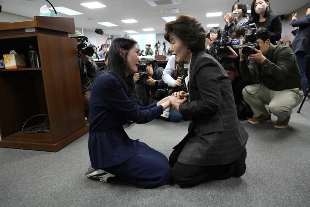 <p>Truth and Reconciliation Commission chairperson Park Sun Young, right, comforts adoptee Yooree Kim during a press conference in Seoul on 26 March 2025</p>