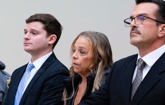 <p>Kim Sullivan who is charged with neglect, stands between her attorneys Jason Spilka, left, and Ioannis Kaloidis, right, during her arraignment Wednesday, March 12, 2025 at Waterbury Superior Court in Waterbury, Conn. (Jim Shannon/Hearst Connecticut Media via AP, Pool)</p>