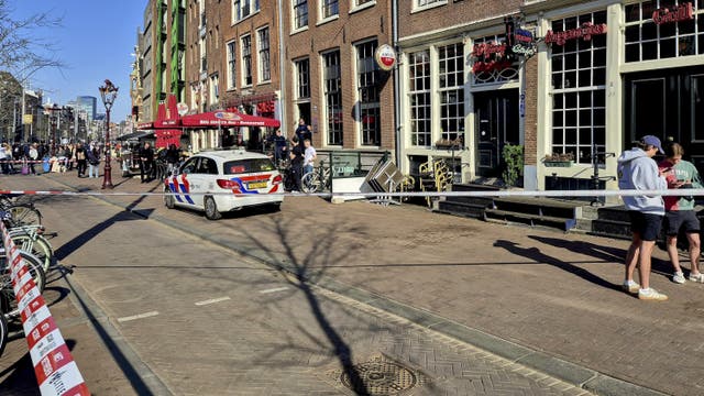 <p>Police have cordoned off the area where five people were wounded during a stabbing near Dam Square</p>
