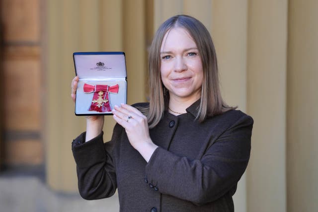 Rebecca Thomson after being made an Officer of the Order of the British Empire at Buckingham Palace (Jonathan Brady/PA)