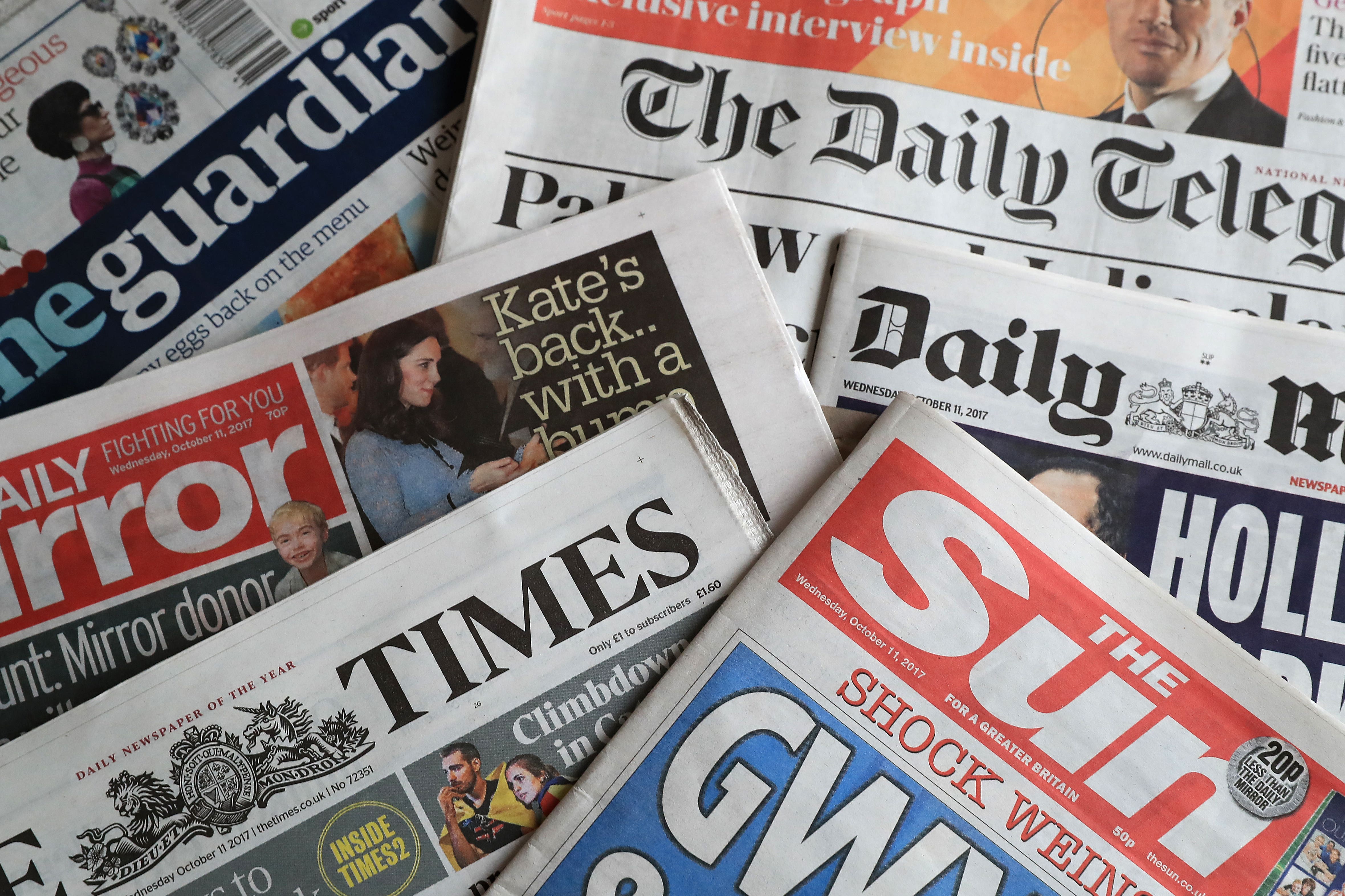 A collection of British newspapers.