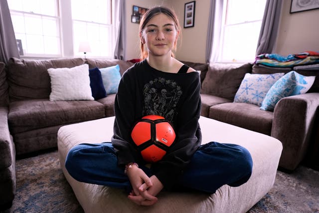 <p>Parker Tirrell, a transgender athlete who plays on her high school's girls soccer team, poses in the living room of her family home, Friday, March 7, 2025, in Plymouth, N.H. (AP Photo/Charles Krupa)</p>