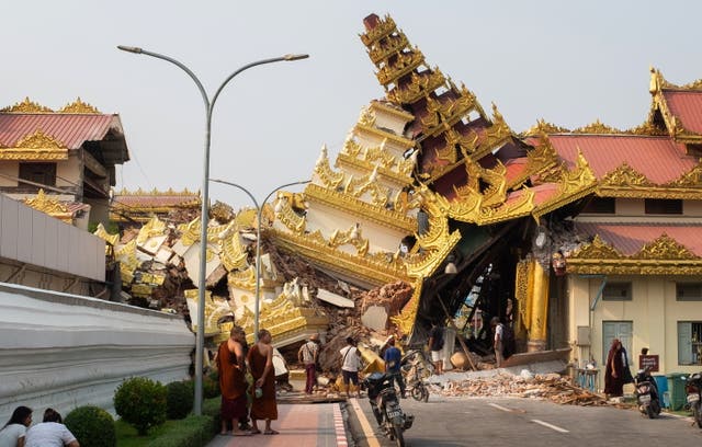 <p>People look at the collapsed Maha Myat Muni Pagoda following an earthquake in Mandalay, Myanmar</p>