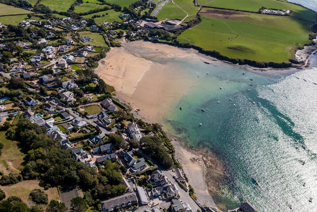 <p>The village of Rock, on the Camel estuary in Cornwall, draws thousands of visitors every summer </p>