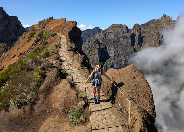 <p>Monica high above the clouds on Madeira's PR1 trail</p>