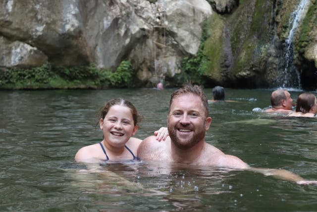 <p>James and Poppy in the freshwater lake at the Polilimnio Waterfalls</p>
