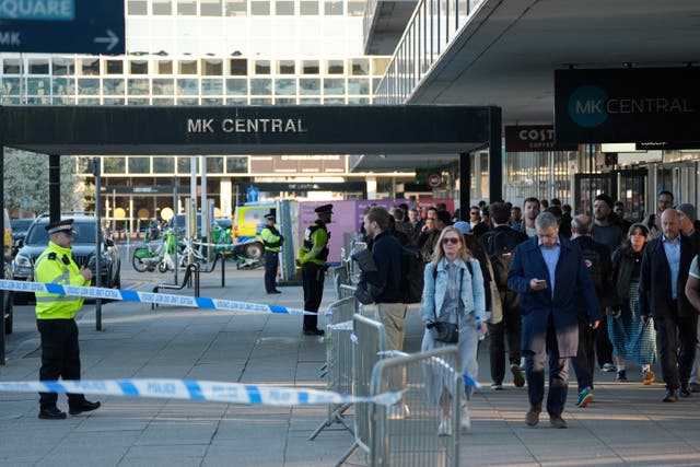 <p>Police officers at Milton Keynes train station</p>