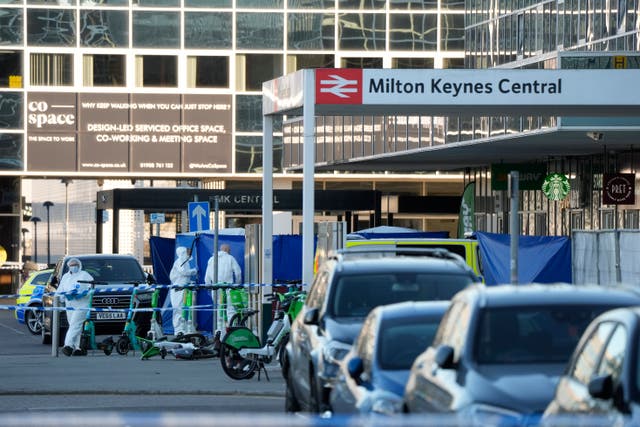 <p>Forensics officers at Milton Keynes train station</p>
