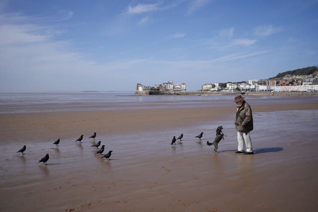 <p>People on the beach in Weston-super-Mare in Somerset </p>