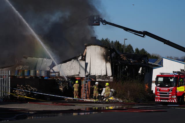 Firefighters at the scene of a fire at an industrial unit in Broomlee Road, Cumbernauld (Andrew Milligan/PA)