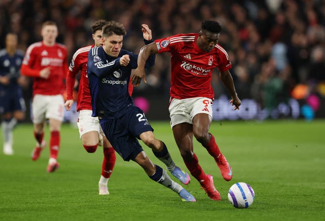 <p>Nottingham Forest striker Taiwo Awoniyi (right) has been placed in an induced coma</p>