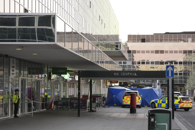 Police at Milton Keynes train station after a man was shot dead by armed officers (Andrew Matthews/PA)