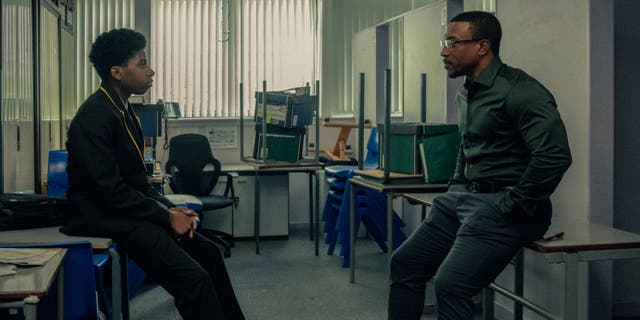 <p>Ashley Walters as DI Luke Bascombe and Amari Bacchus as his onscreen son, who explains the importance of emojis to incel culture</p>