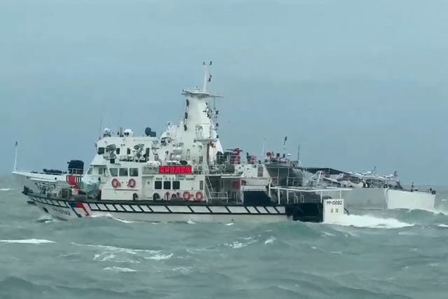 <p>Photo released by the Taiwan Coast Guard shows a Taiwanese ship, front, and a Chinese ship sailing in waters off the Matsu Islands in Taiwan on 1 April 2025 </p>