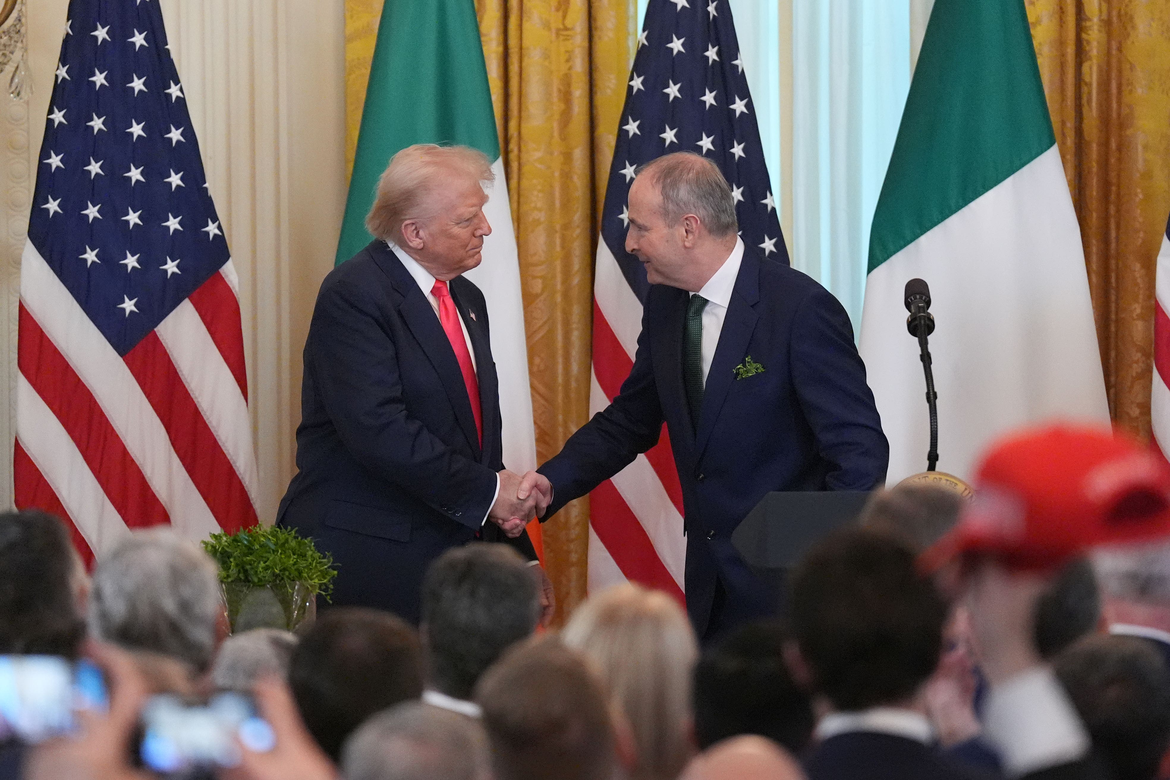Taoiseach Micheal Martin and US President Donald Trump during the St Patrick’s Day Reception and Shamrock Ceremony in the White House (Niall Carson/PA)