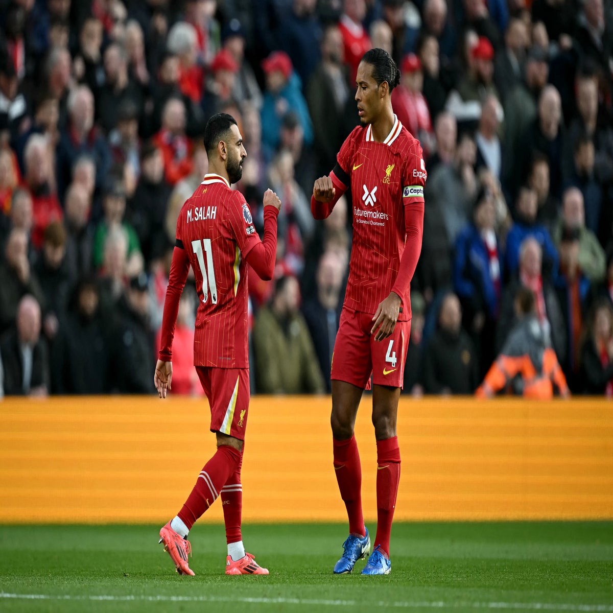 Liverpool's Milan Baros and Vladimir Smicer stand dejected as they wait