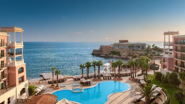 <p>While sand is limited at the The Westin Dragonara Resort, the hotel’s loungers overlook the sparkling Mediterranean Sea</p>