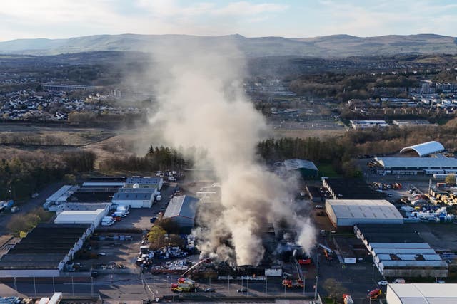 Fire fighters at the scene of a fire at an industrial unit in Broomlee Road, Cumbernauld, North Lanarkshire (Andrew Milligan/PA)