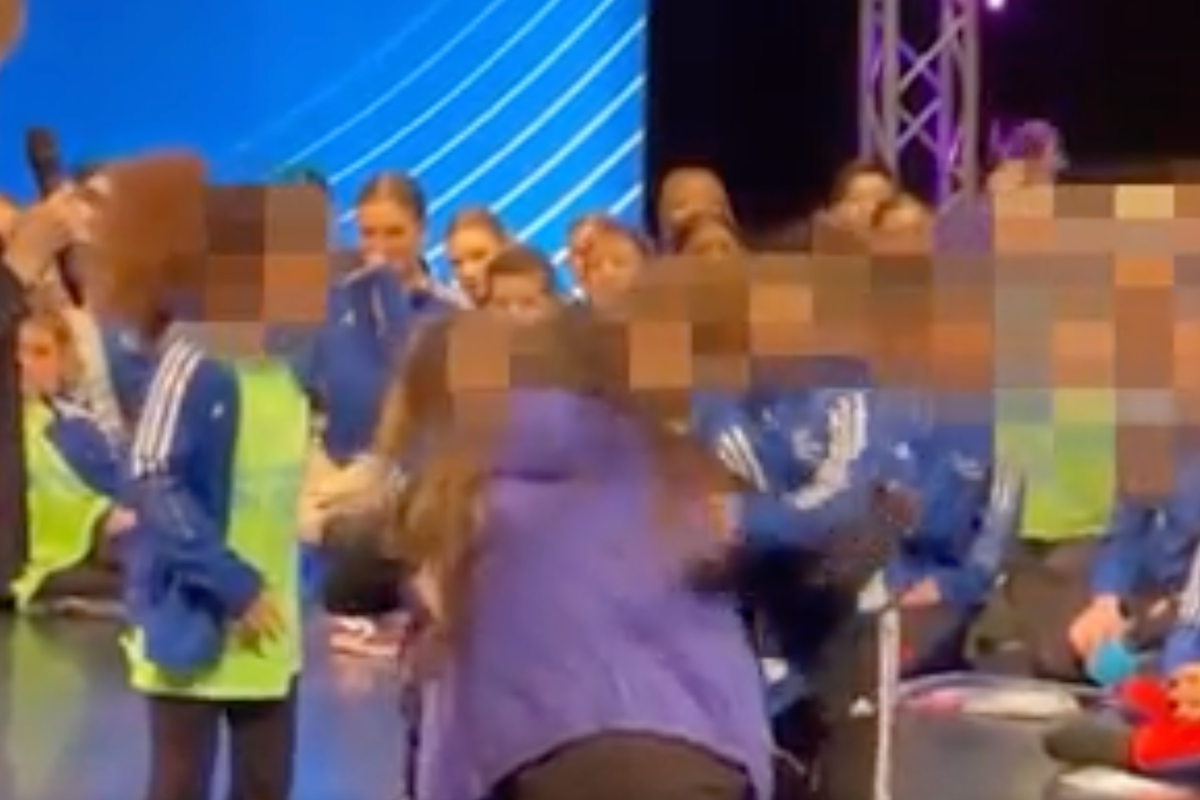 Viral video shows dance coach hugging team after win - except the Black team member Viral video shows dance coach hugging team after win - except the Black team member